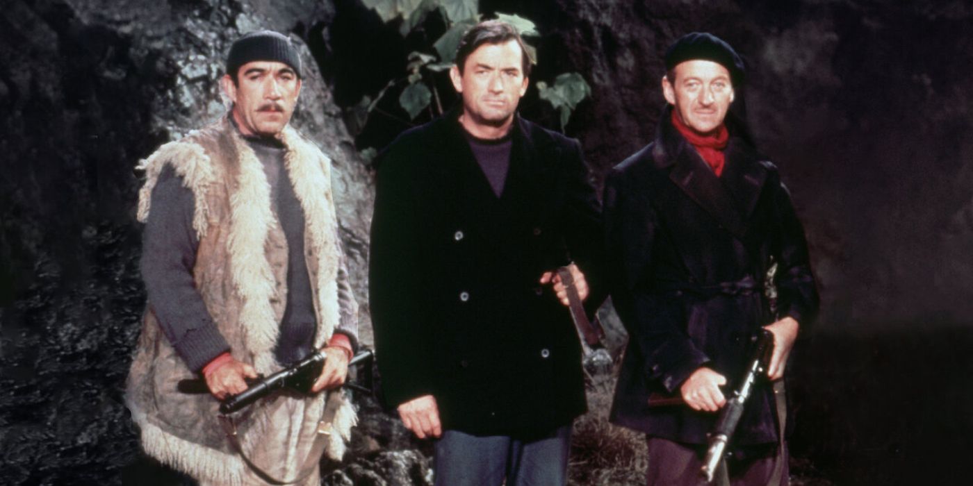 Still frame of three men holding guns from the war adventure film 'The Guns of Navarone'