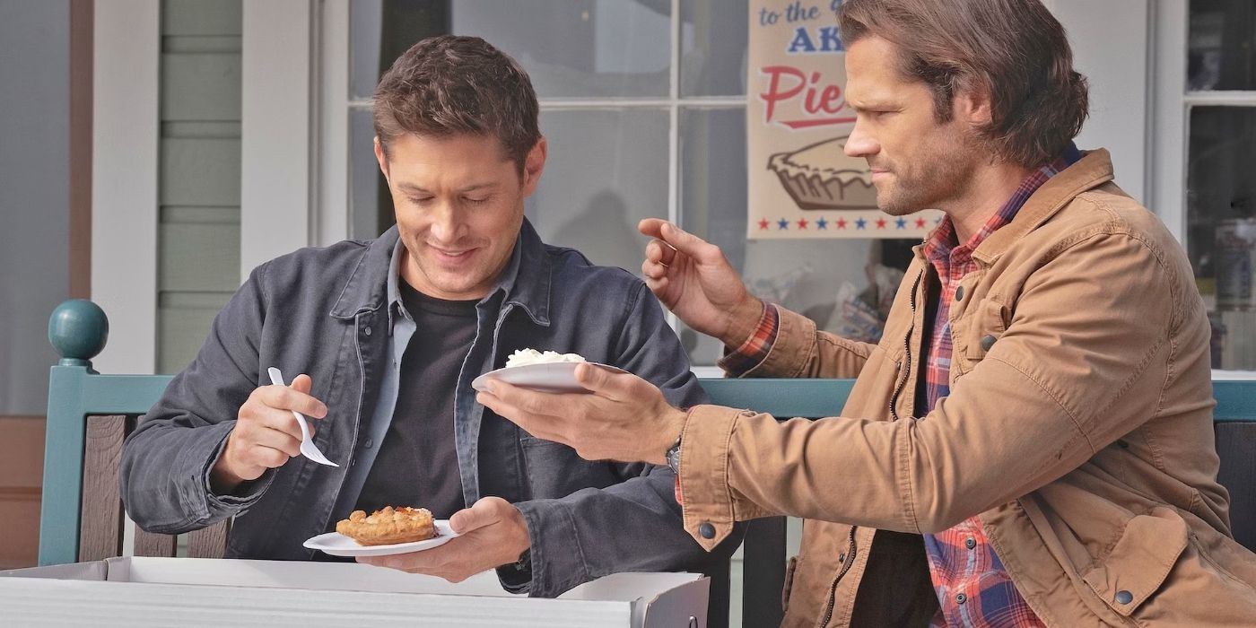 Dean and Sam Winchester (played by Jensen Ackles and Jared Padalecki) sit on a bench with slices of pie in the series finale of Supernatural
