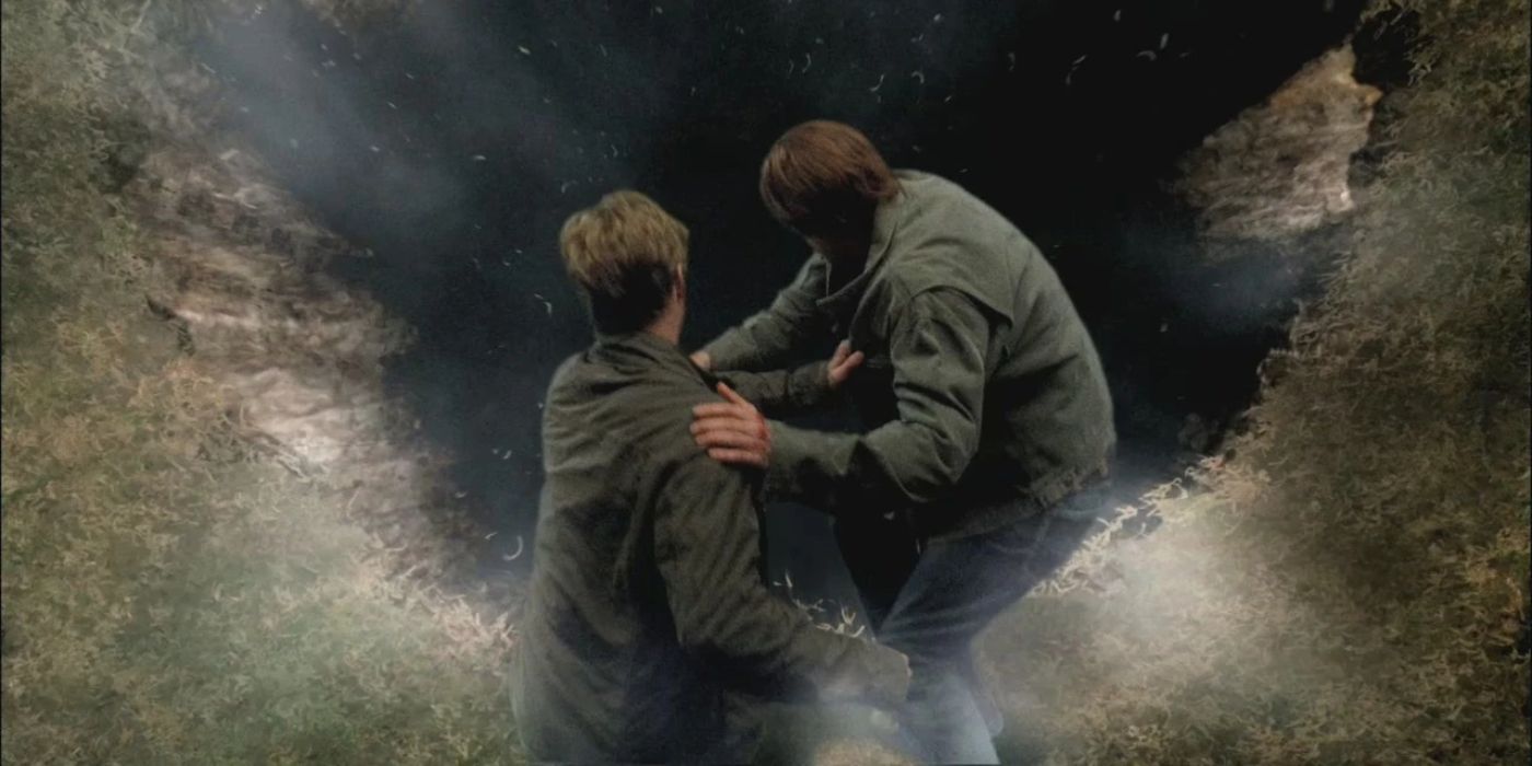 Sam Winchester tackles the archangel Michael into Lucifer's cage, a dark, gaping hole in the ground.