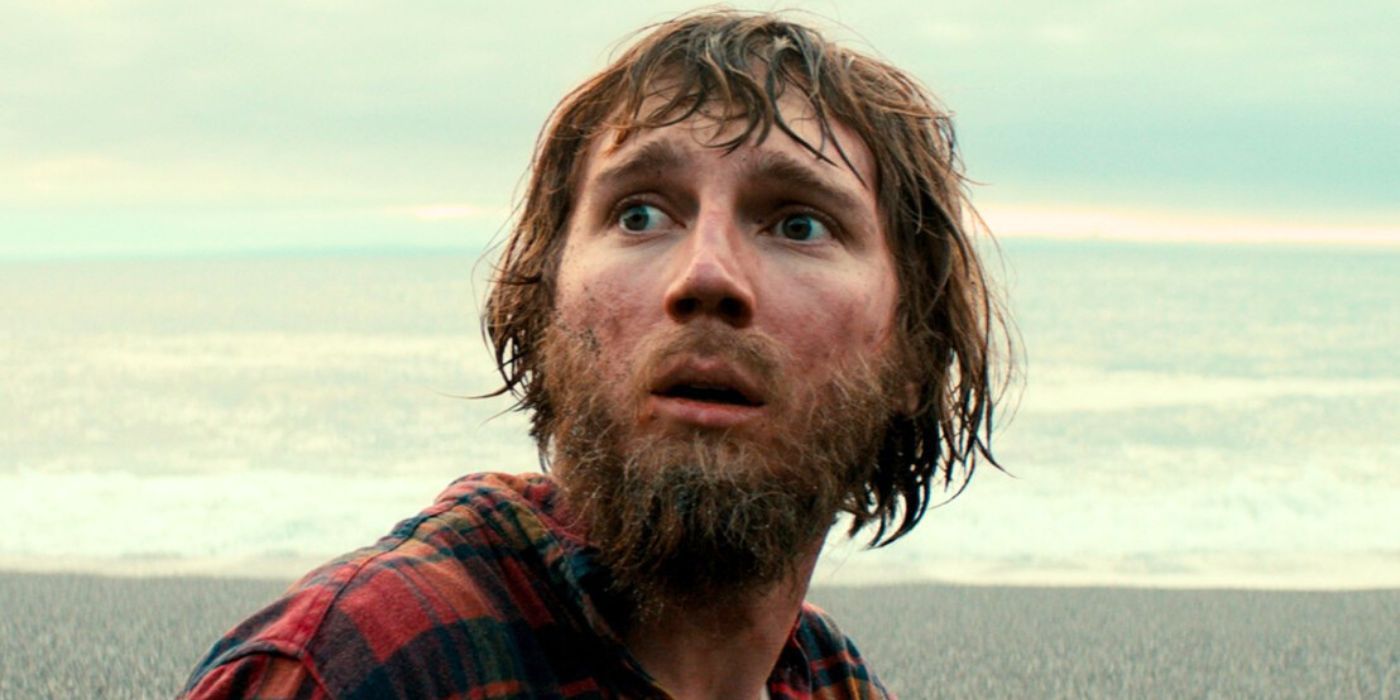 A close-up of Paul Dano on the shore in Swiss Army Man