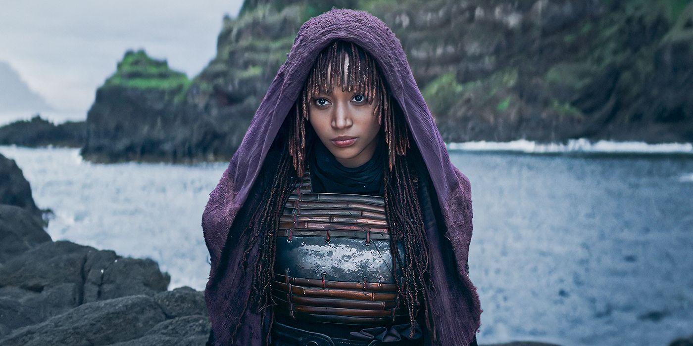 Amandla Stenberg as Mae beside a body of water in The Acolyte