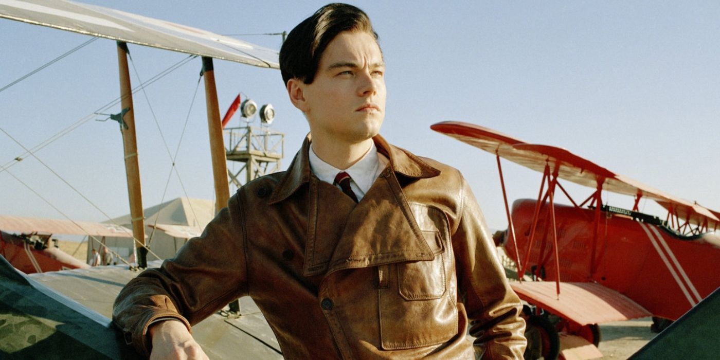 Leonardo DiCaprio as Howard Hughes leans on a plane in The Aviator 