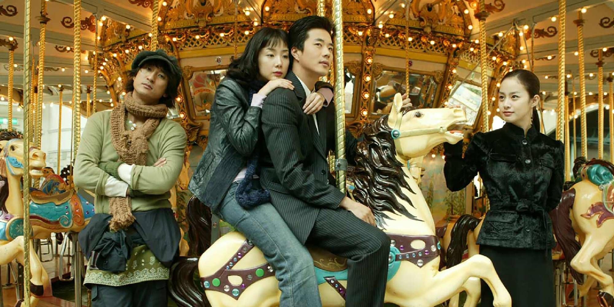 The cast of Stairway to Heaven riding a carousel