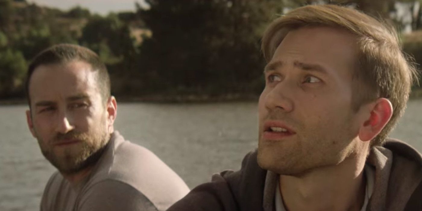 Justin and Aaron, played by actor/directors Justin Benson and Aaron Moorhead, talk while sat on a lake in The Endless.