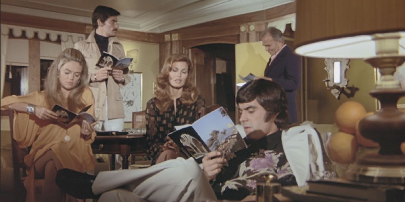 A group of wealthy visitors to a yacht party lounge around in a living area in &lsquo;The Last of Sheila&rsquo; (1973)