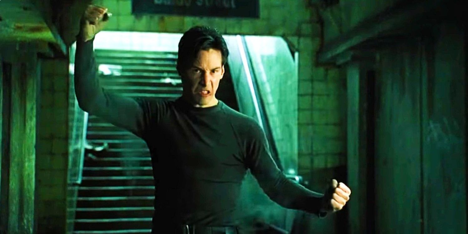 Neo poses with his arms out after learning Kung fu in 'The Matrix'