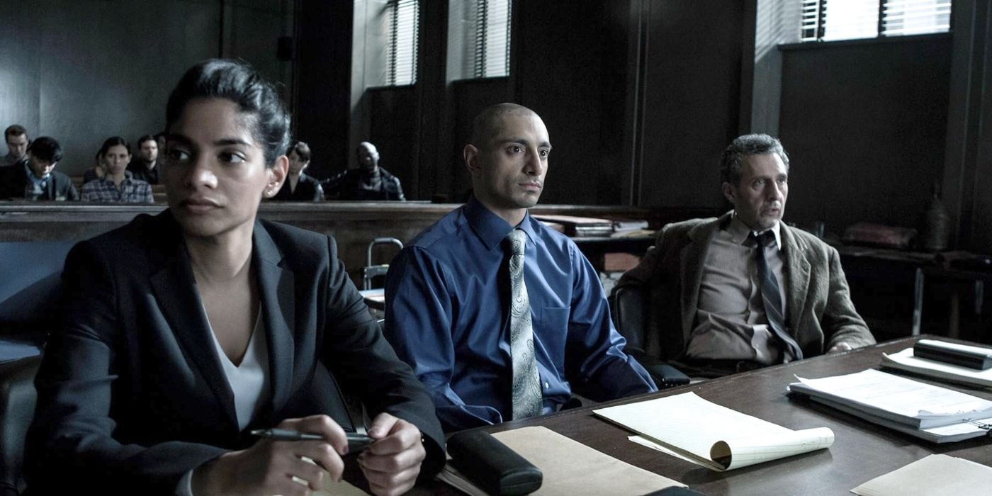 Chandra Kapoor (Amara Karan), Nasir 'Naz' Khan (Riz Ahmed), and John Stone (John Turturro) sitting seriously in a courtroom in The Night Of.