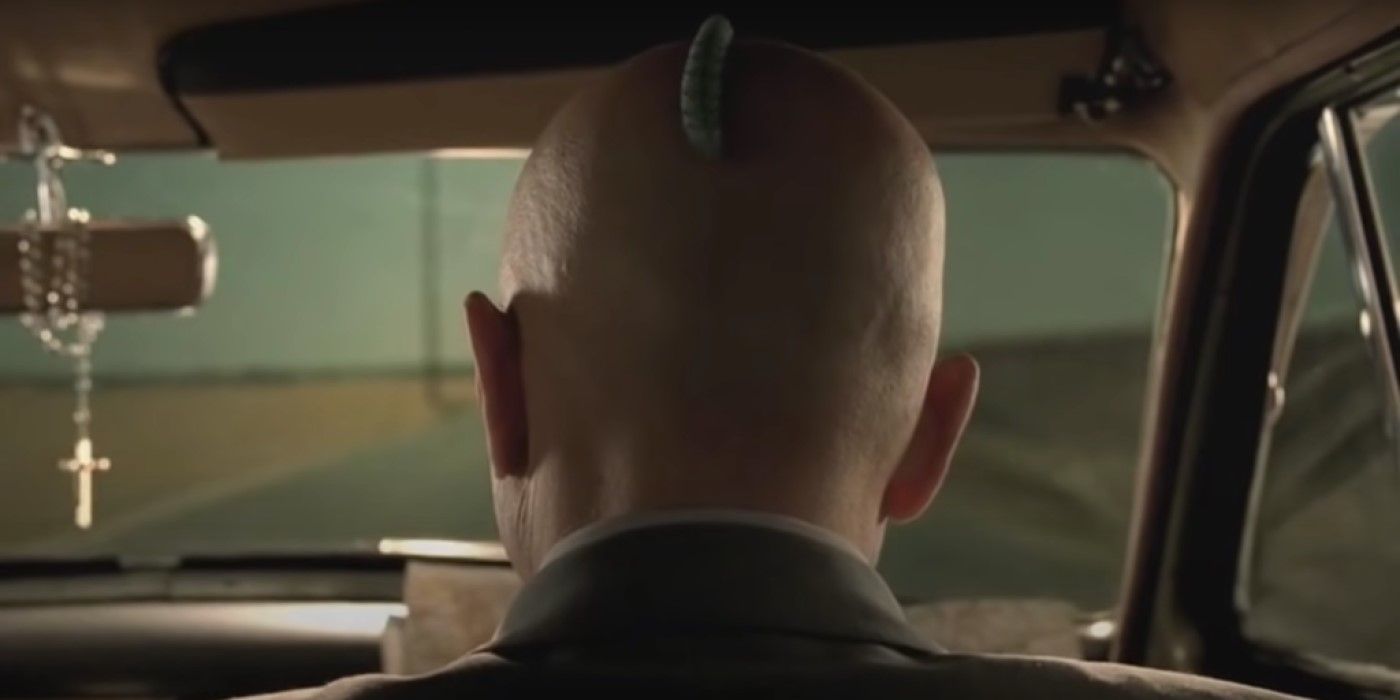 Ralphie (Joe Pantoliano) with a caterpillar on his head in 