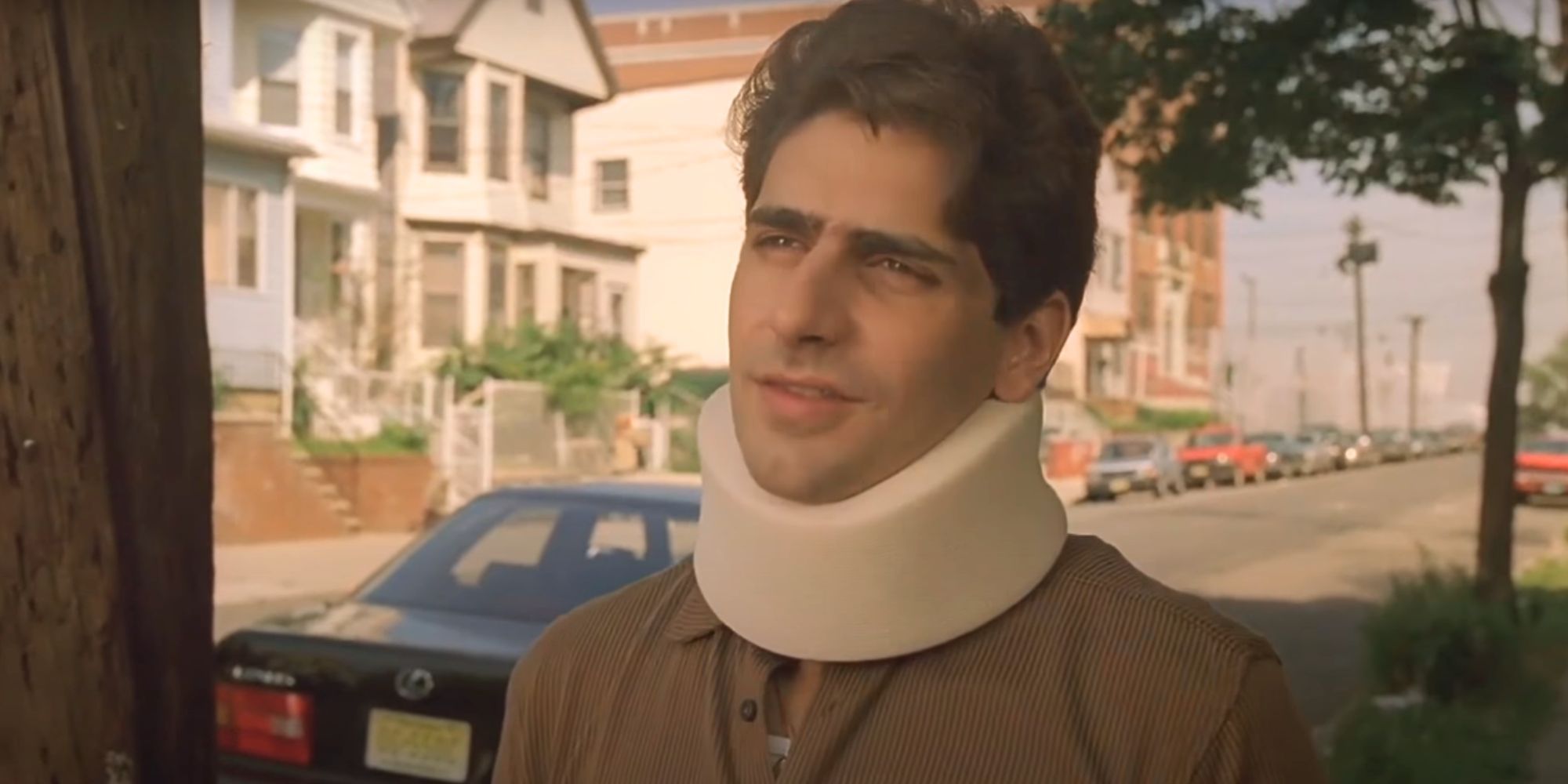 Michael Imperioli wearing a neck brace in The Sopranos