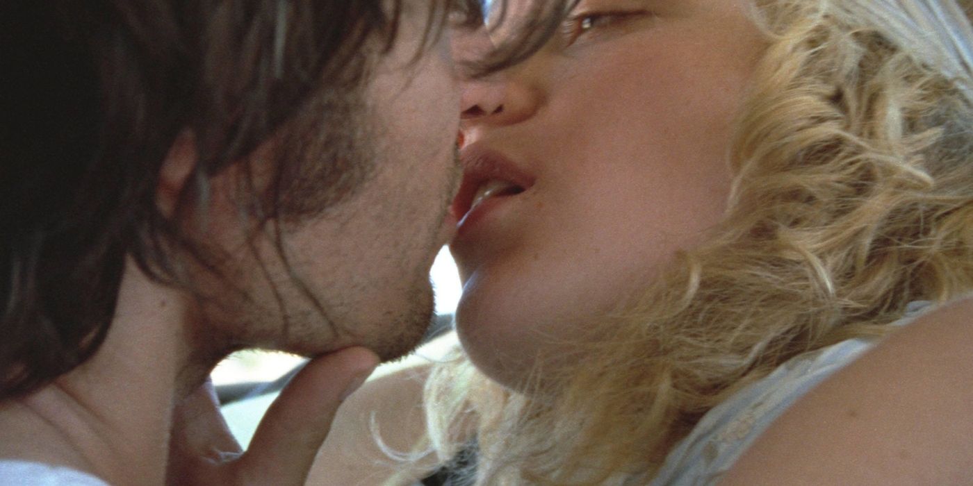 Vincent Gallo and Chloe Sevigny stare at each other while they kiss in The Brown Bunny