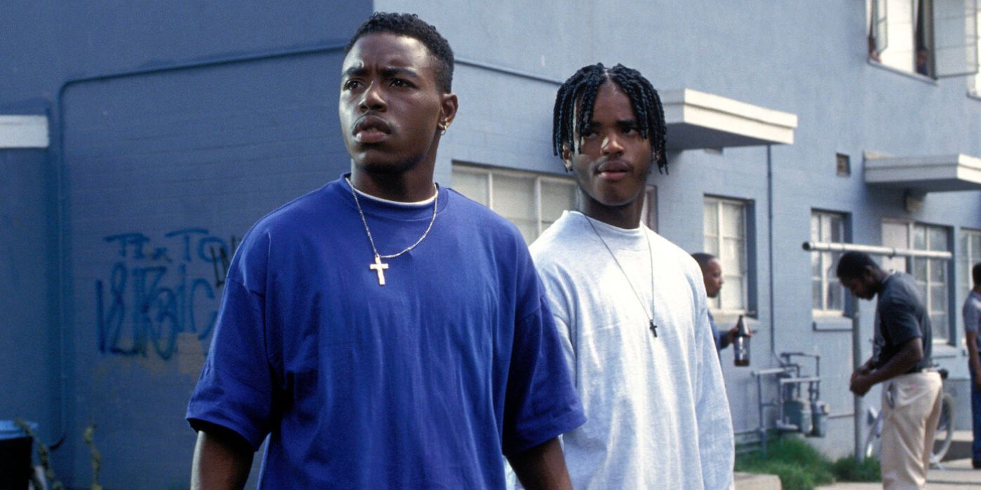 Two young Blackmen looking to the distance with confused expressions in Menace-II-Society