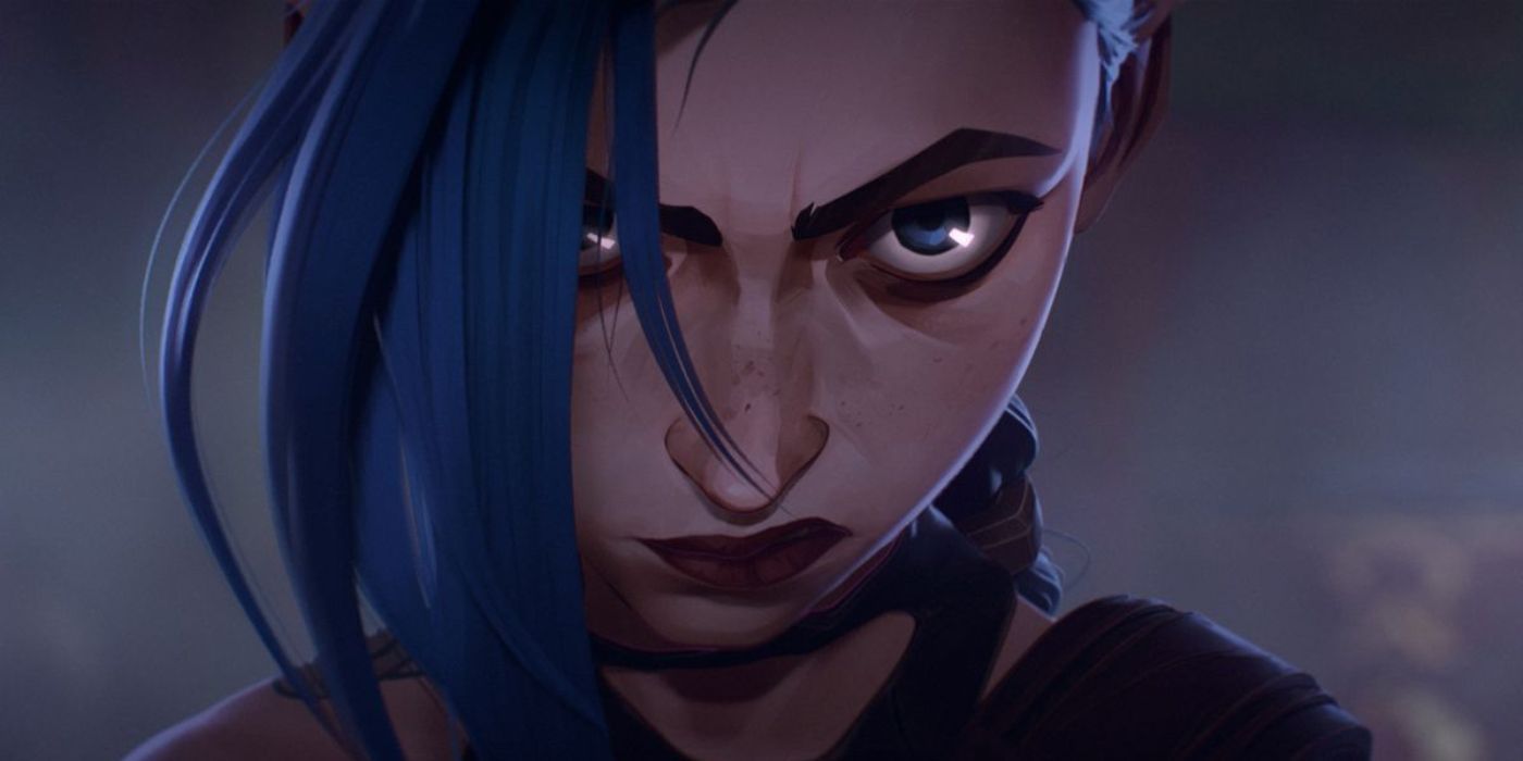 Jinx (Ella Purnell) stands, center of frame, with a determined glare and one eye hidden behind a strand of blue hair in a still from &lsquo;Arcane&rsquo; season 2.