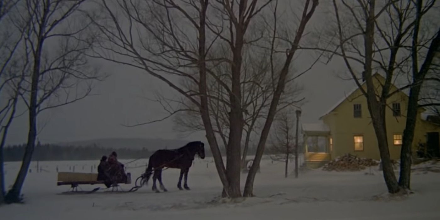 A horse-pulled carriage in a snow-covered town in 'Mon Oncle Antoine'