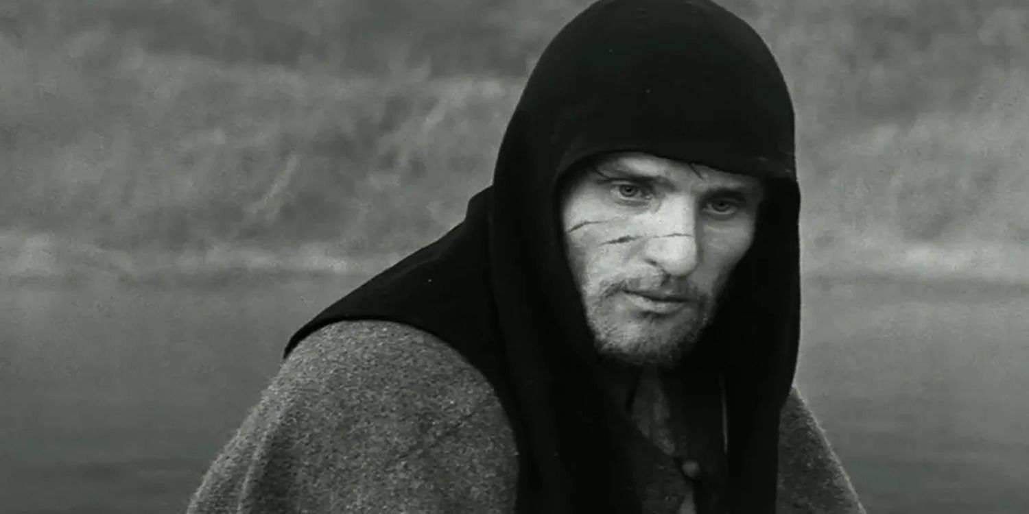 Anatoly Solonitsyn with a hood on by a river in &lsquo;Andrei Rublev&rsquo;