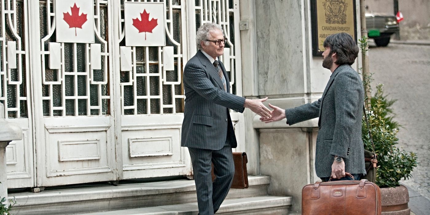 Ben Affleck and Victor Garber as Tony Mendez and Ken Taylor, shaking hands on the steps of the Canadian Embassy in Argo