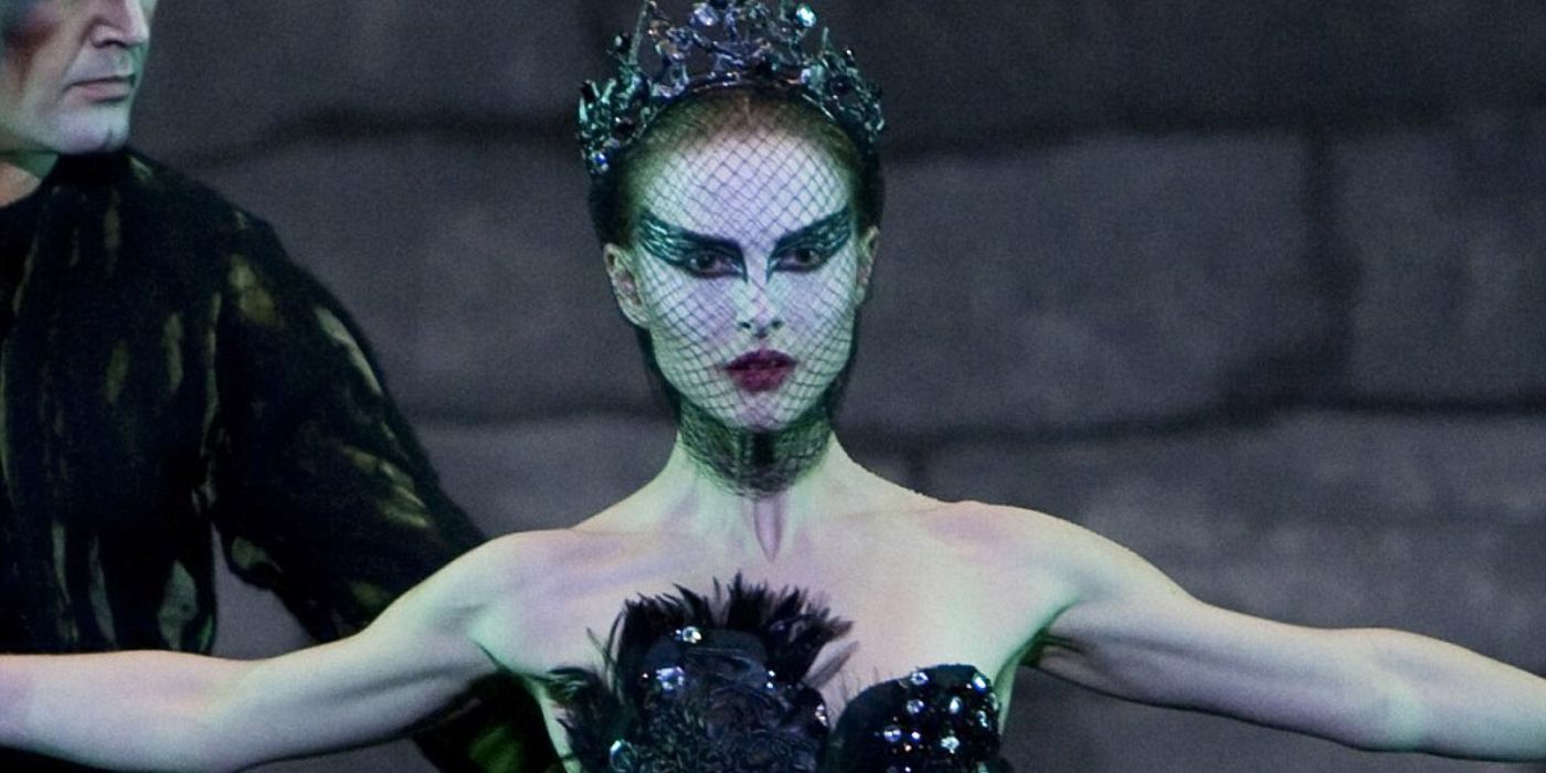 Nina as the Black Swan performing on stage with a male dancer in 'Black Swan'