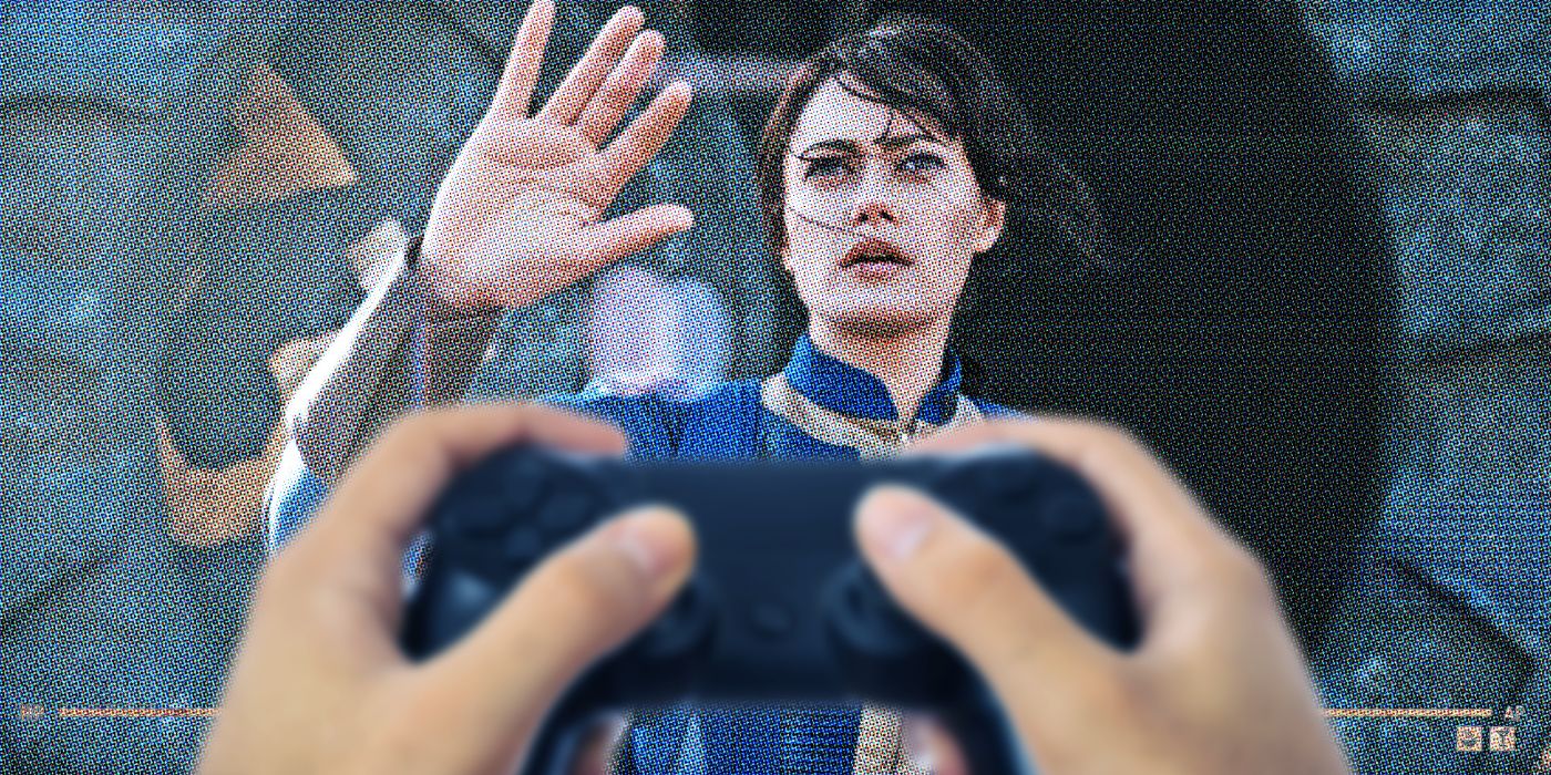 An image of someone holding a game controller in front of Lucy (Ella Purnell) from Fallout on a TV screen