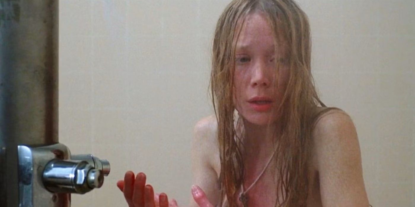 Carrie White (Sissy Spacek) looking scared in the shower in 'Carrie'