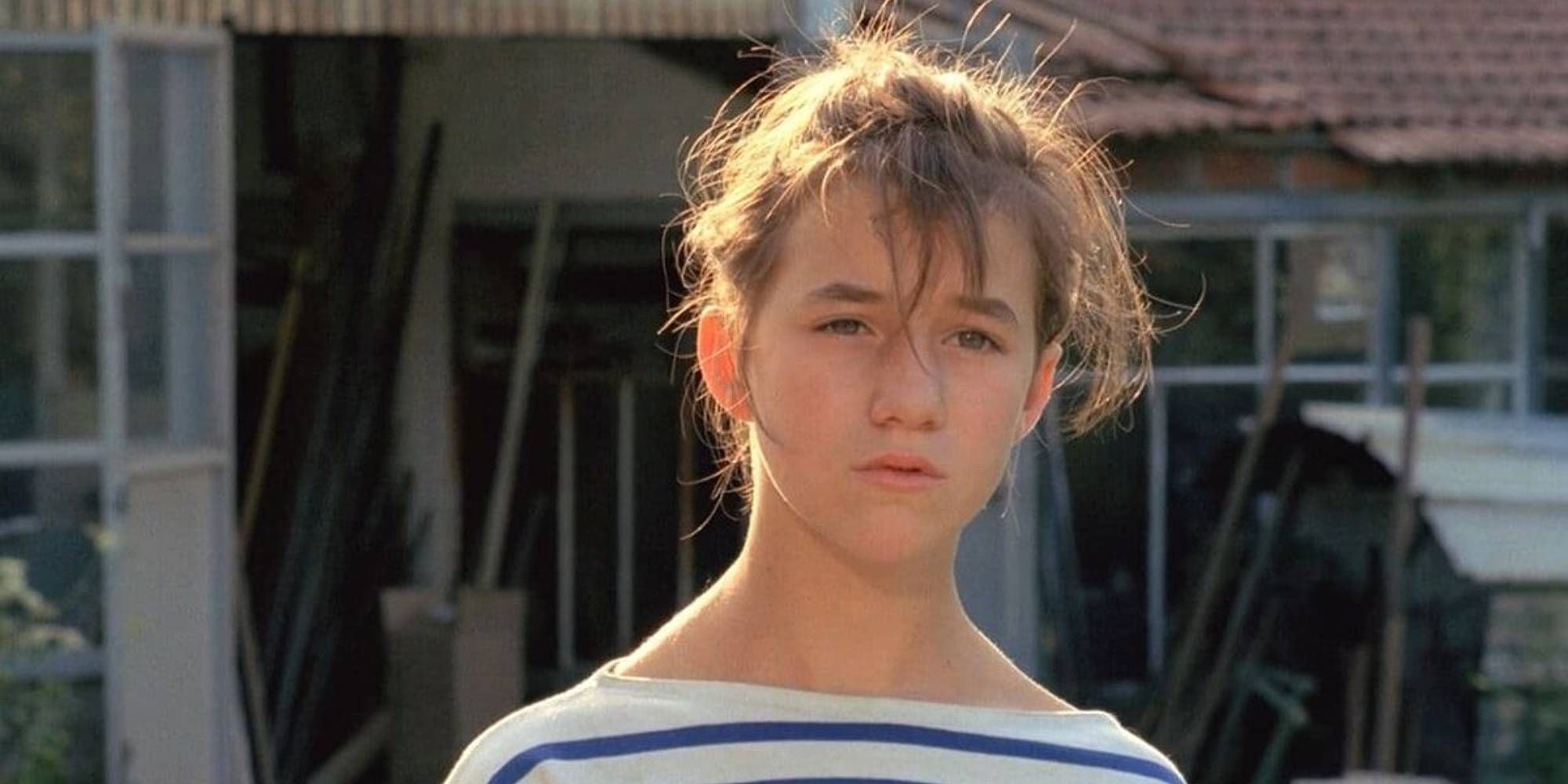 Close-up shot of Charlotte Gainsbourg as a young girl in An Impudent Girl.