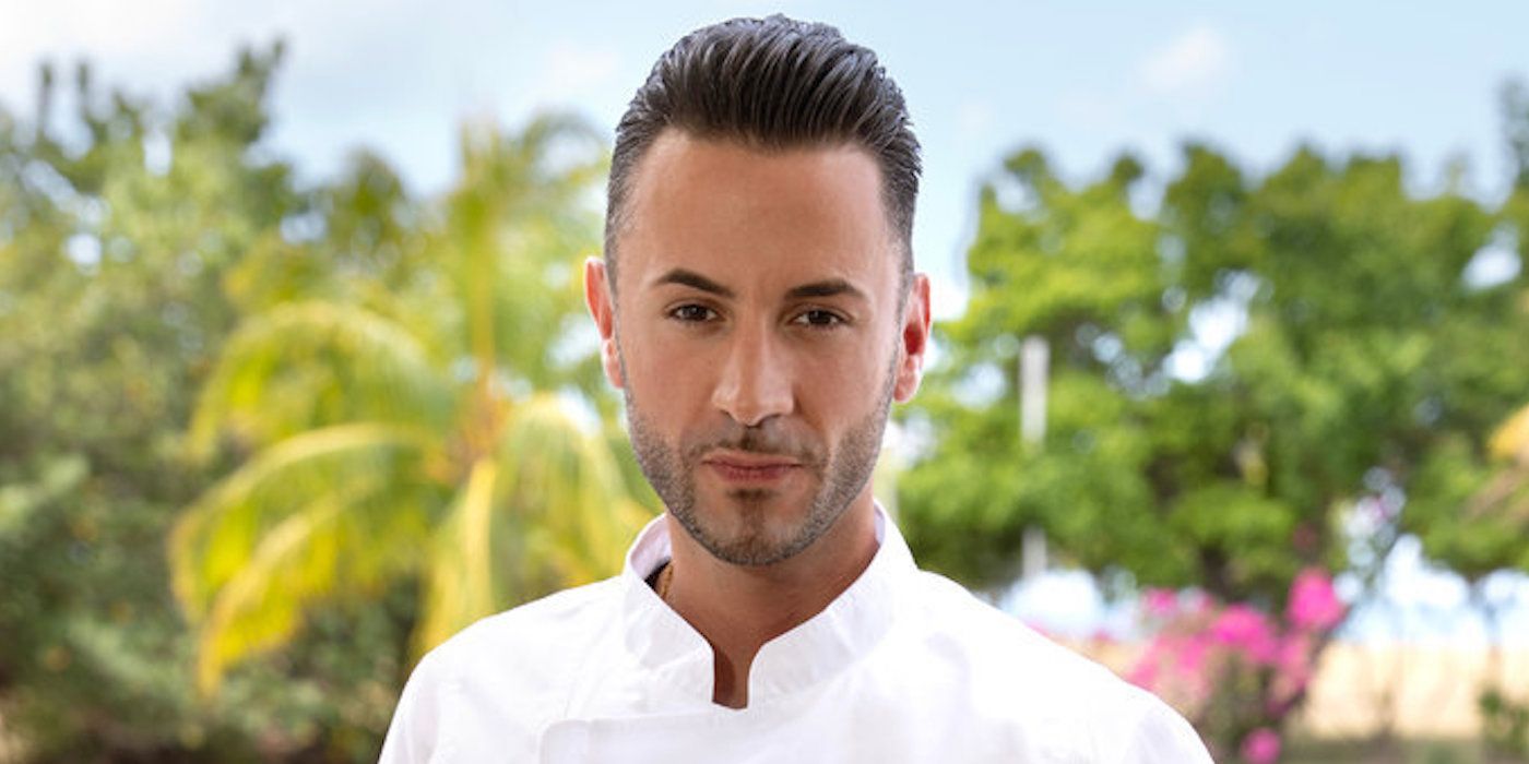 Chef Anthony Iracane in his white chef's uniform with palm trees in the background