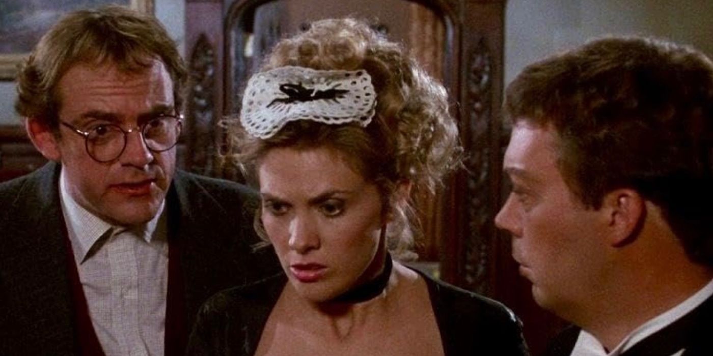 Professor Plum and Mr. Boddy's butler (Tim Curry) stand on either side of a maid in Clue (1985).