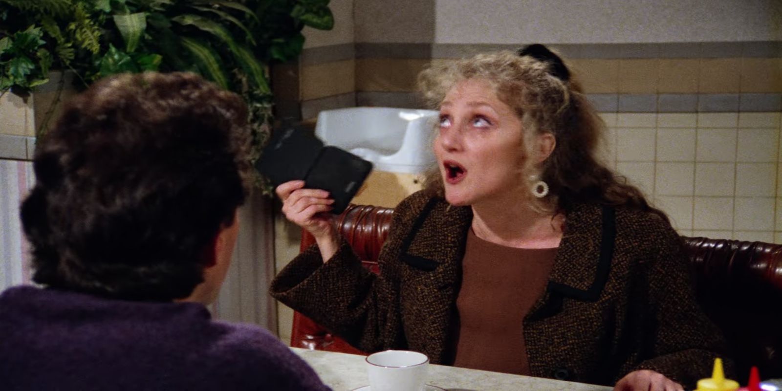 Corinne, played by Carol Kane, gives Jerry, played by Jerry Seinfeld, an electronic organizer