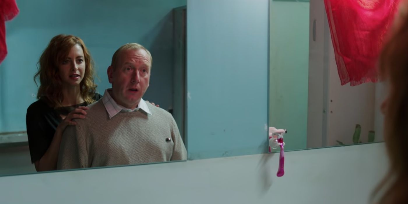 Melody (Julie Dray) making Colin (Adrian Scarborough) look at himself in the mirror in 'Crashing'