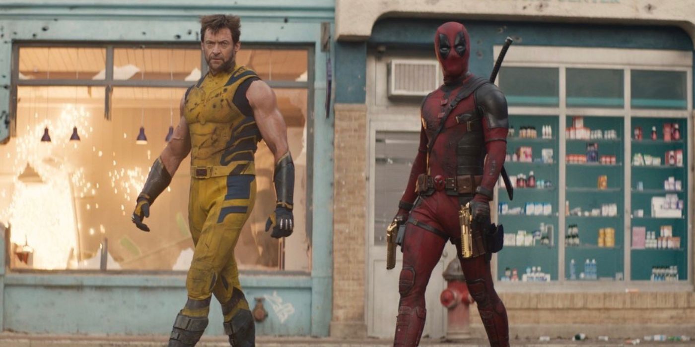 Deadpool and Wolverine walking side by side in front of an exploding store