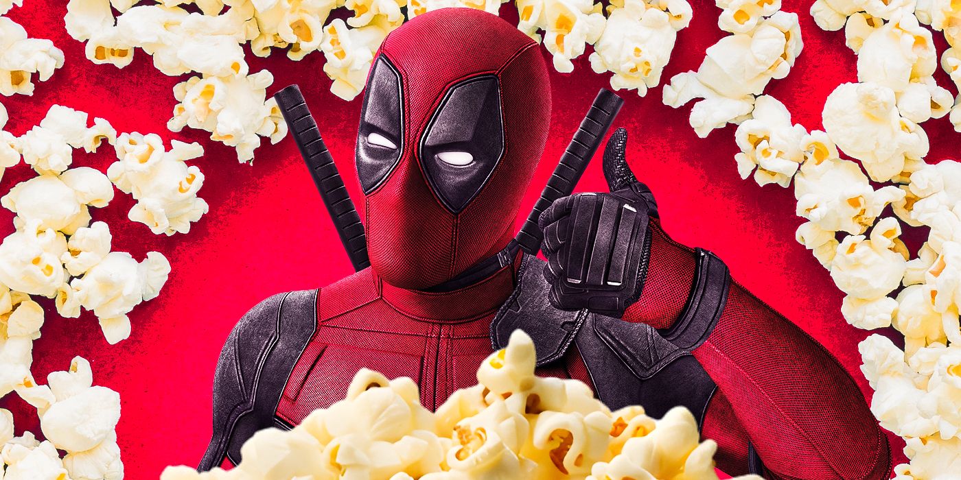 Ryan Reynolds aka Deadpool poses in a ring of popcorn while giving a thumbs up.