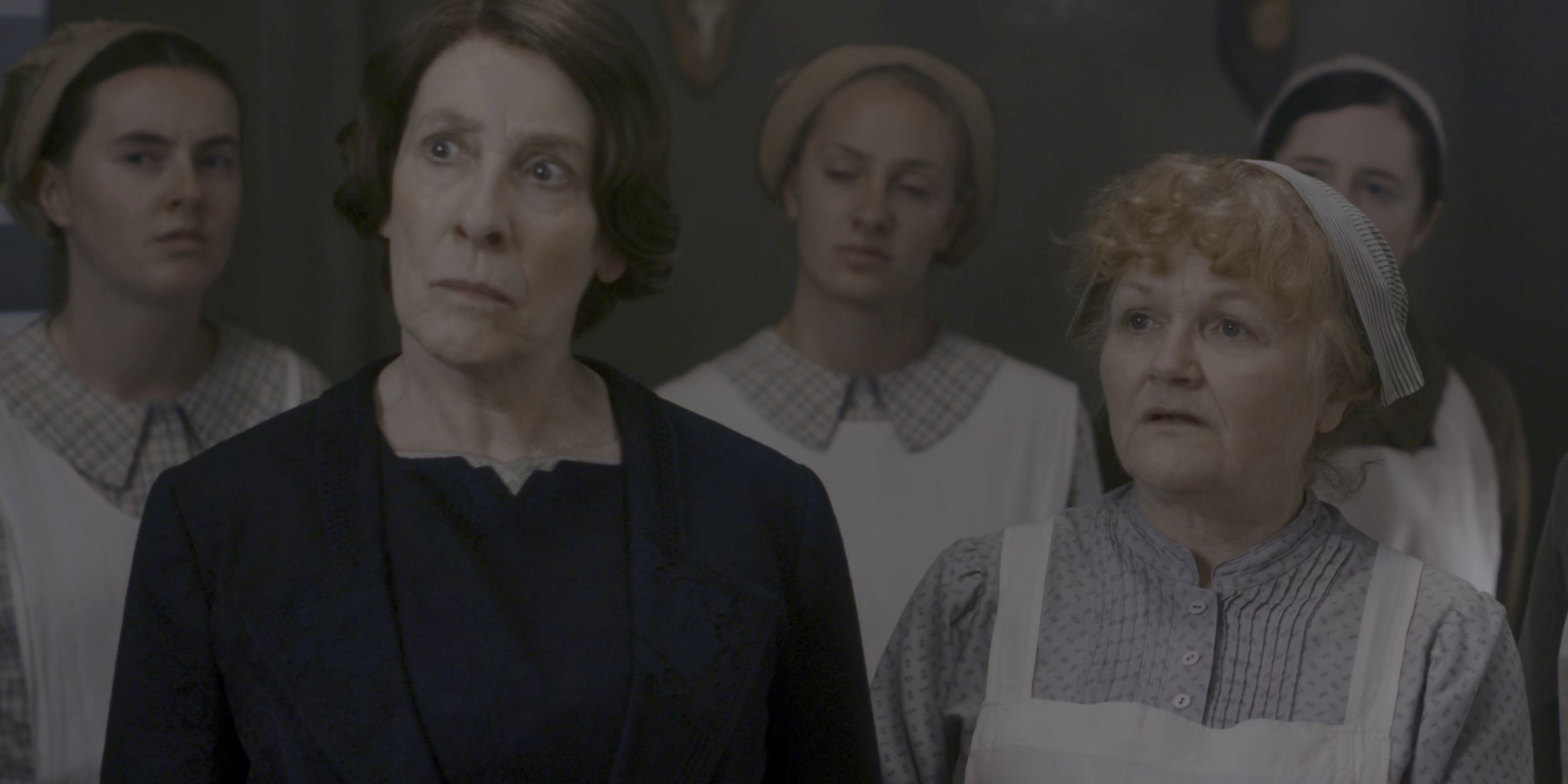 Phyllis Logan and Lesley Nicol in front of the maids in the Downton Abbey movie