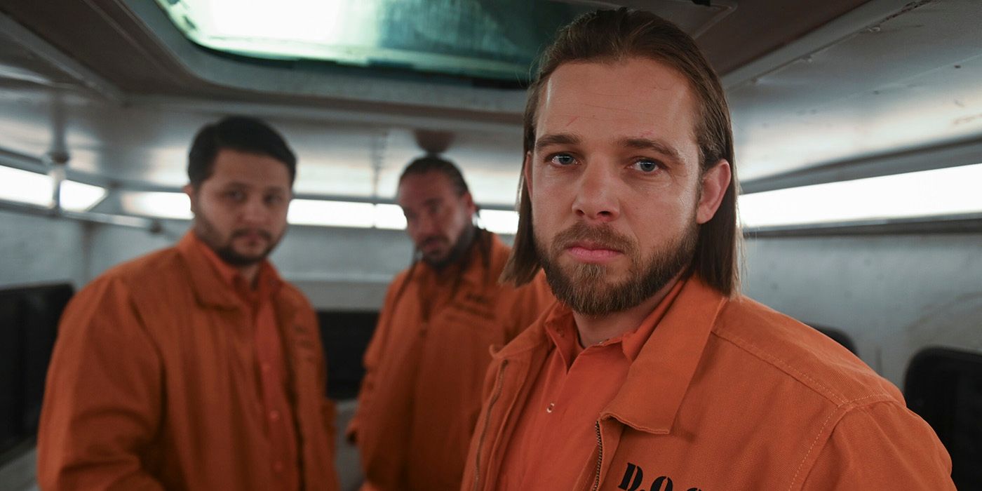 Max Thieriot flanked by two other inmates in Fire Country Season 2