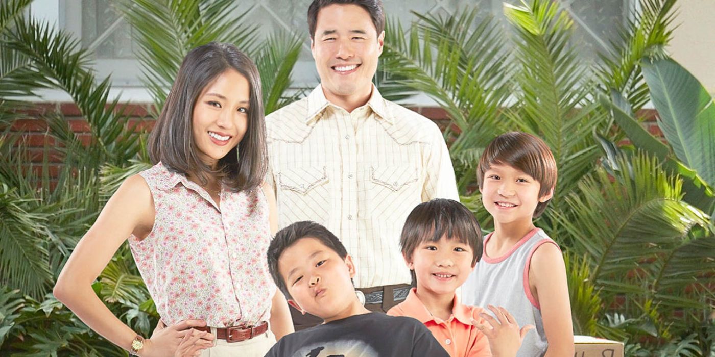 From left to right: Top row: Jessica & Louis Huang. Bottom row: Eddie, Evan, & Emery Huang. All are standing in front of palm leaves. 