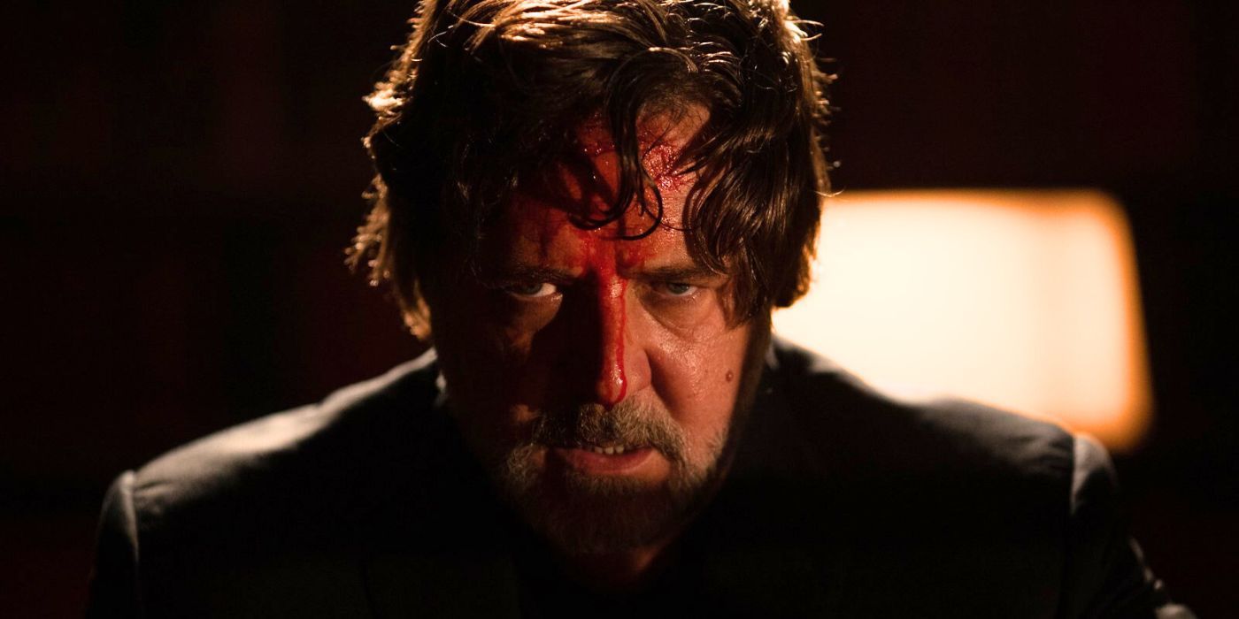 Russell Crowe's face covered in blood in The Exorcism.