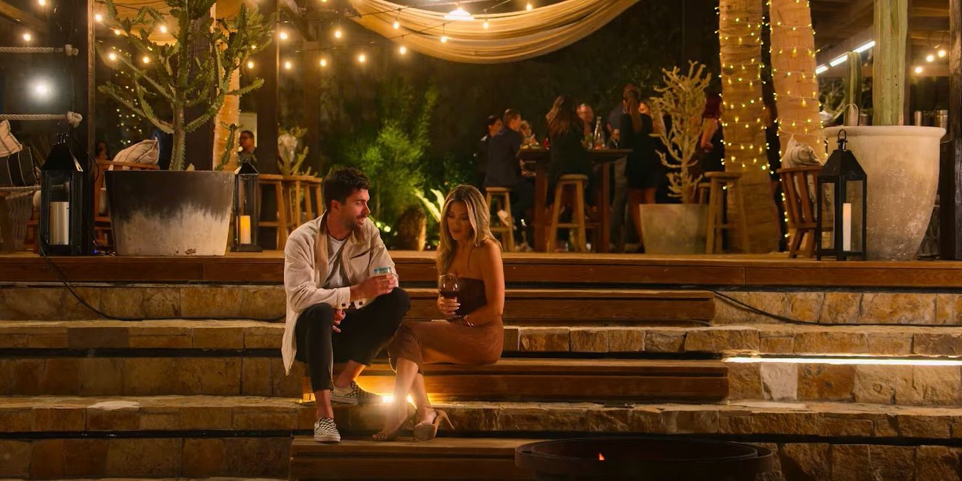 Tyler Stanaland and Alex Hall chat while sitting on a stone step, 'Selling The OC' season 2