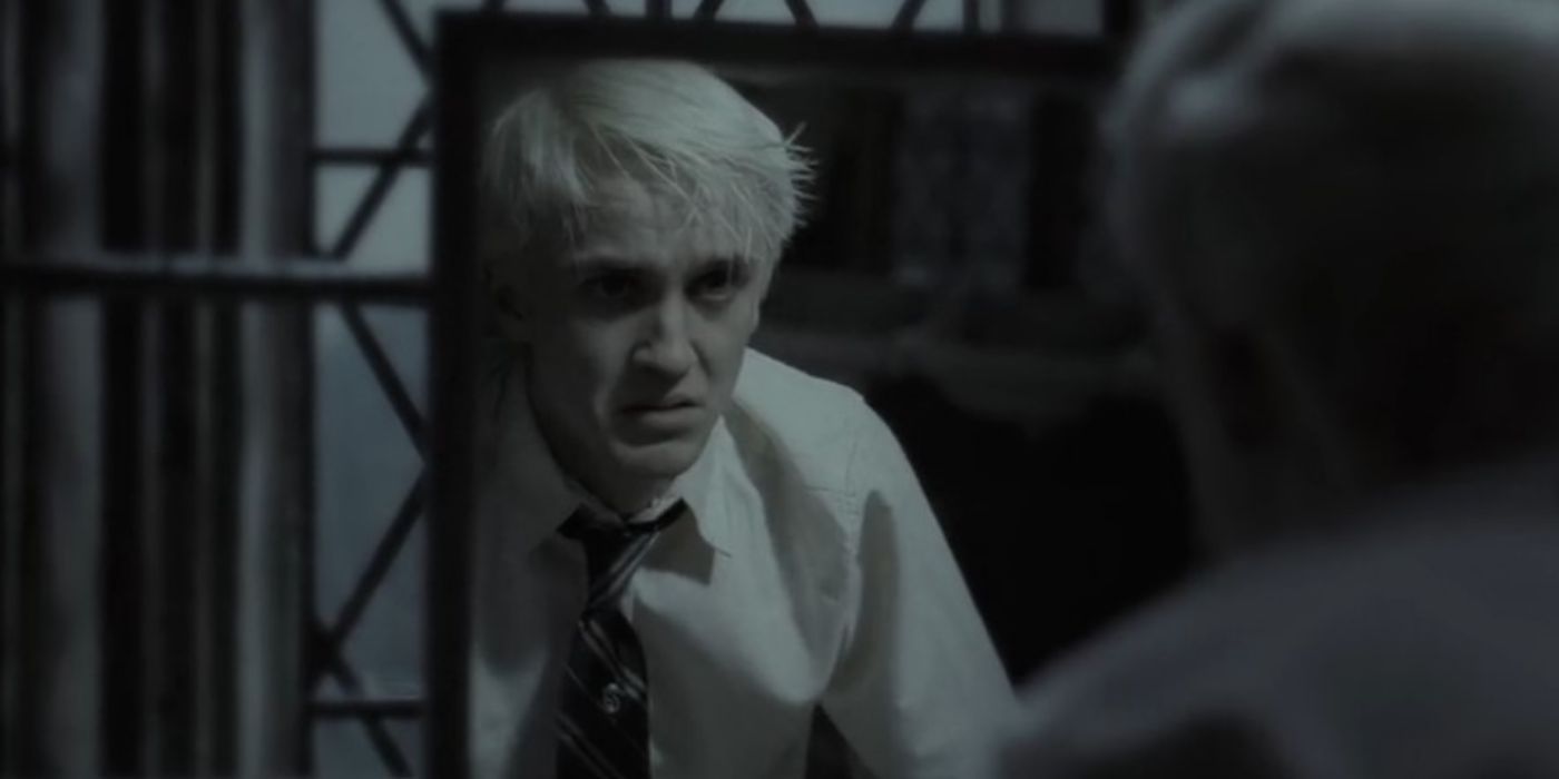 Tom Felton as Draco Malfoy looking at his reflection in 'Harry Potter and the Half-Blood Prince'