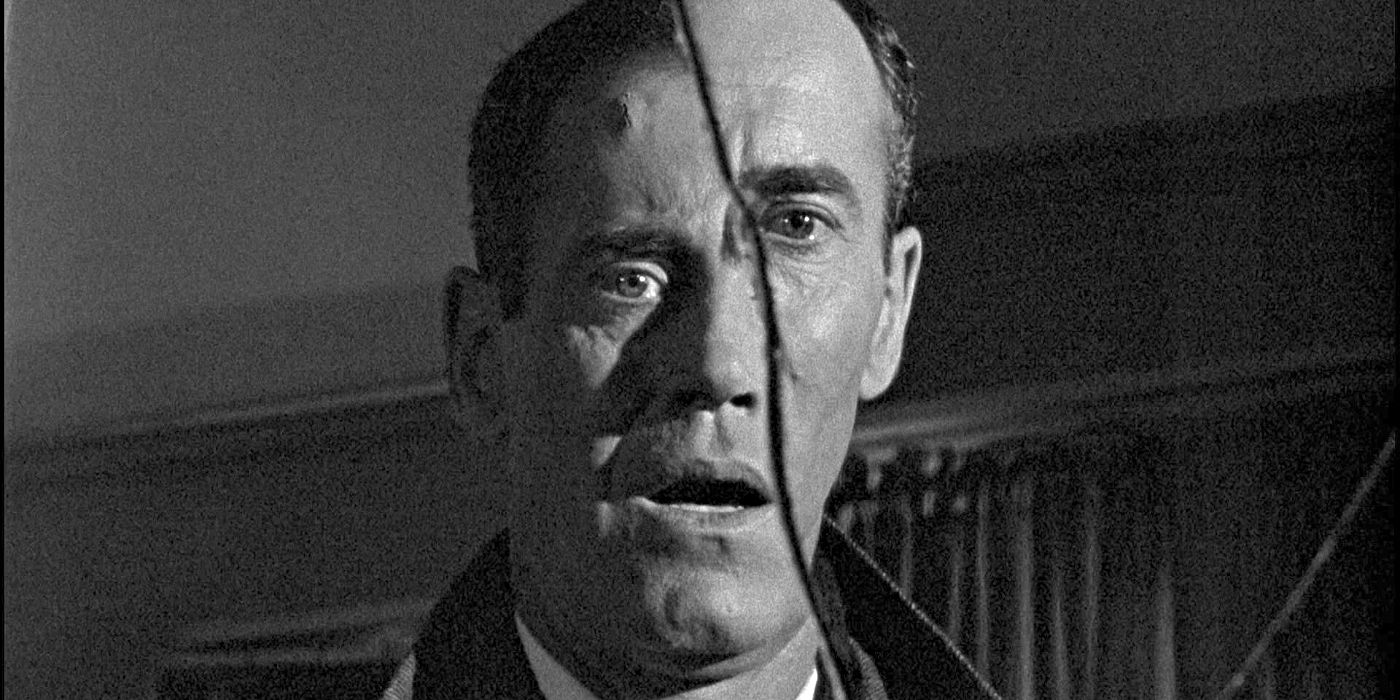 Henry Fonda as Manny, looking sadly in a broken mirror in The Wrong Man