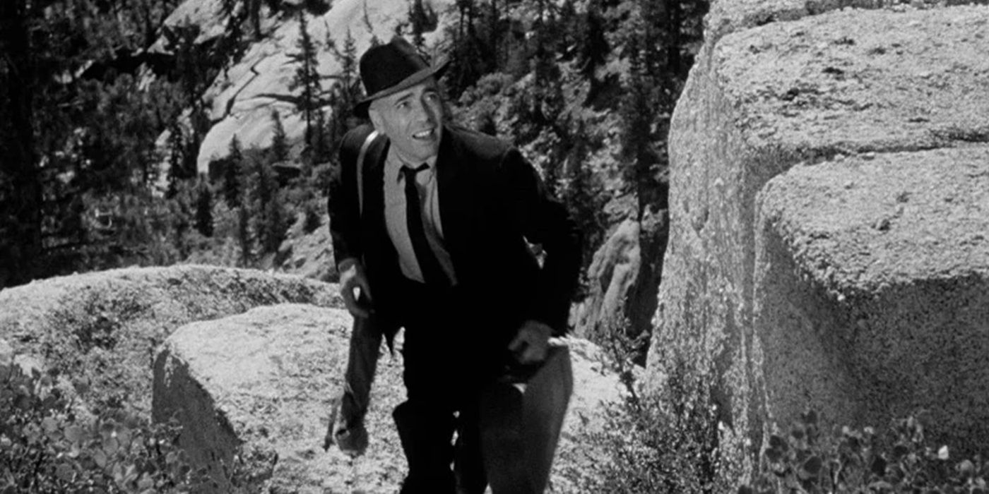 Humphrey Bogart as Roy Earle in 'High Sierra' climbing a mountain