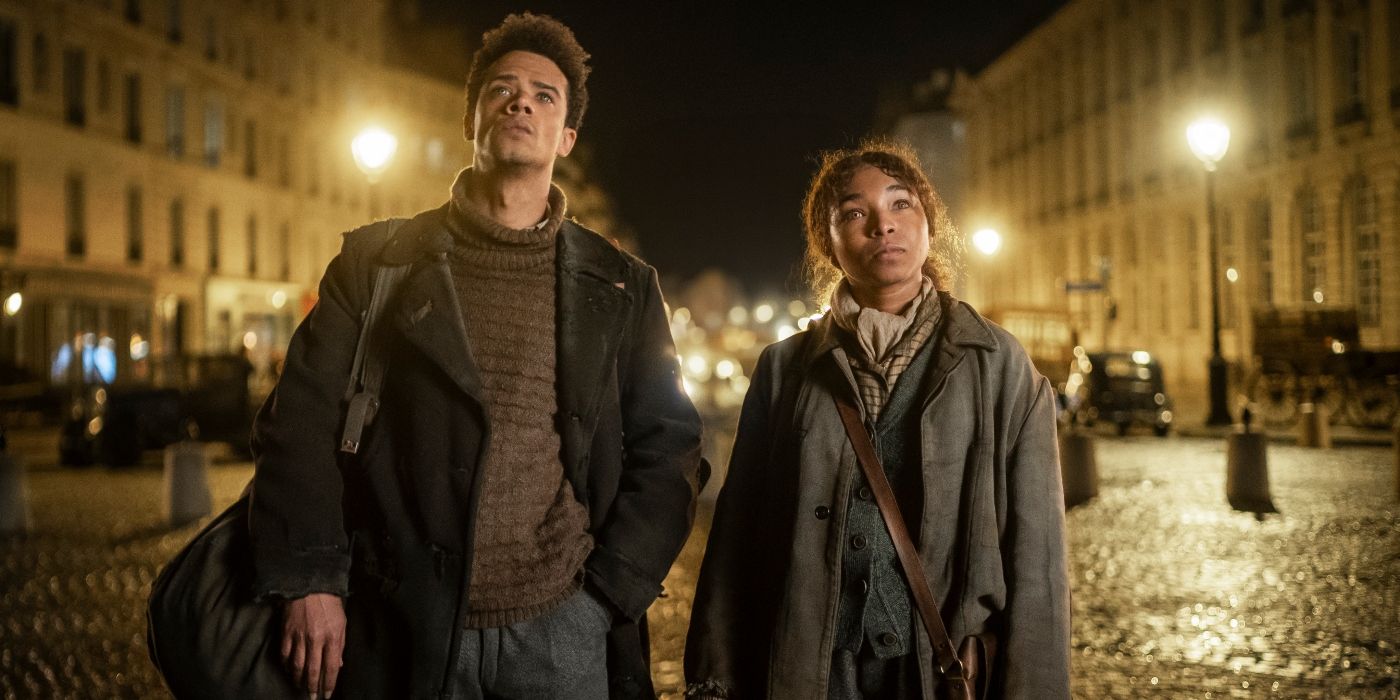 Jacob Anderson and Delainey Hayles standing on the streets of Paris at night in Interview with the Vampire Season 2