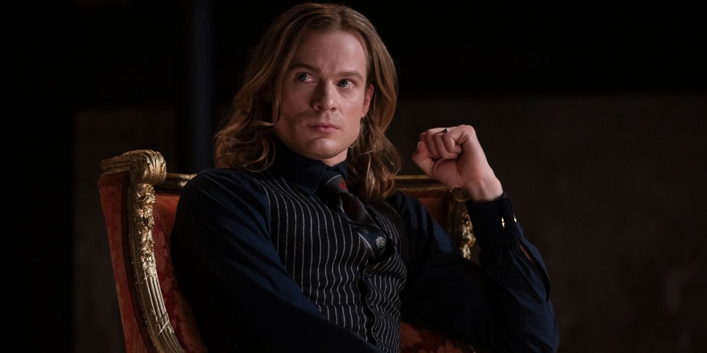Sam Reid as Lestat sitting in a chair with his left hand in a fist in Interview with the Vampire Season 2
