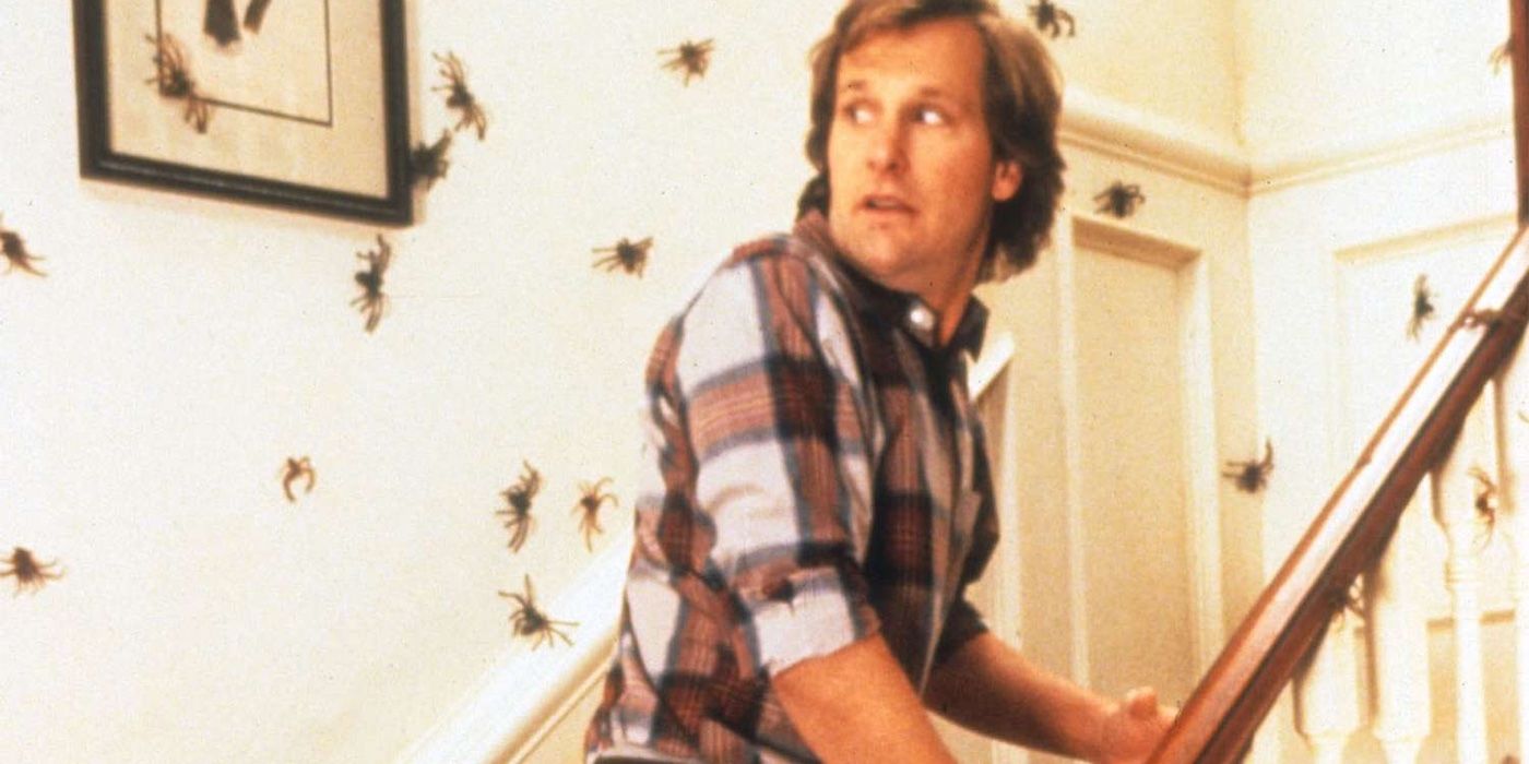 Dr. Ross Jennings (Jeff Daniels) climbs a staircase while spiders crawl all over the walls in 'Arachnophobia'