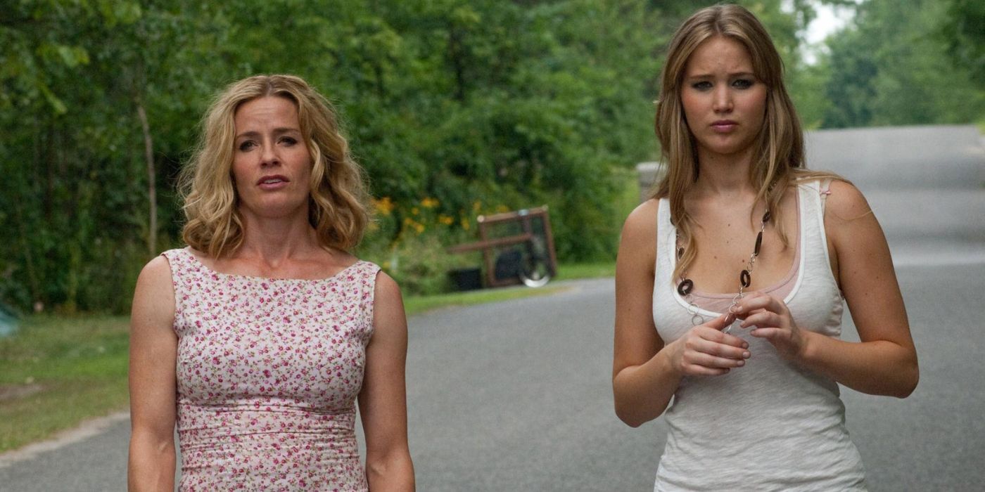 Sarah and Elissa standing in the middle of a road in House at the End of the Street