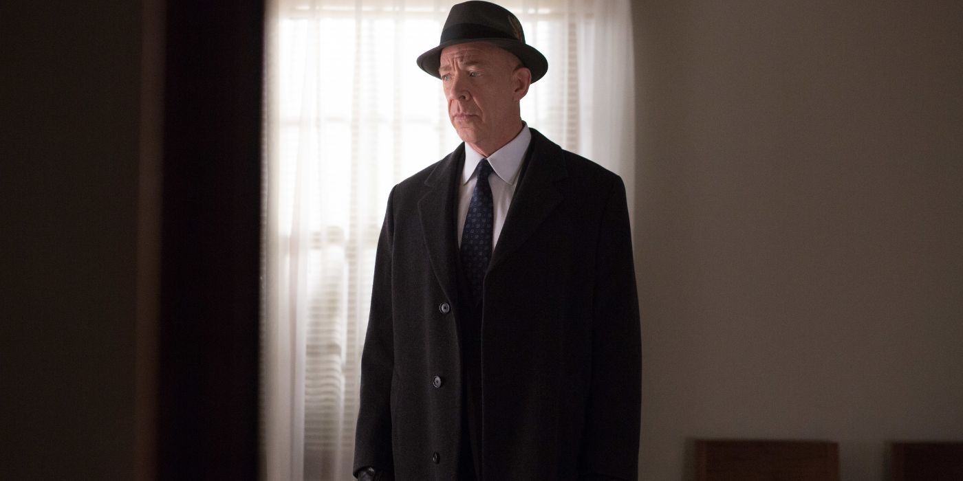 J.K. Simmons as Ray King, wearing a jacket and hat in The Accountant.