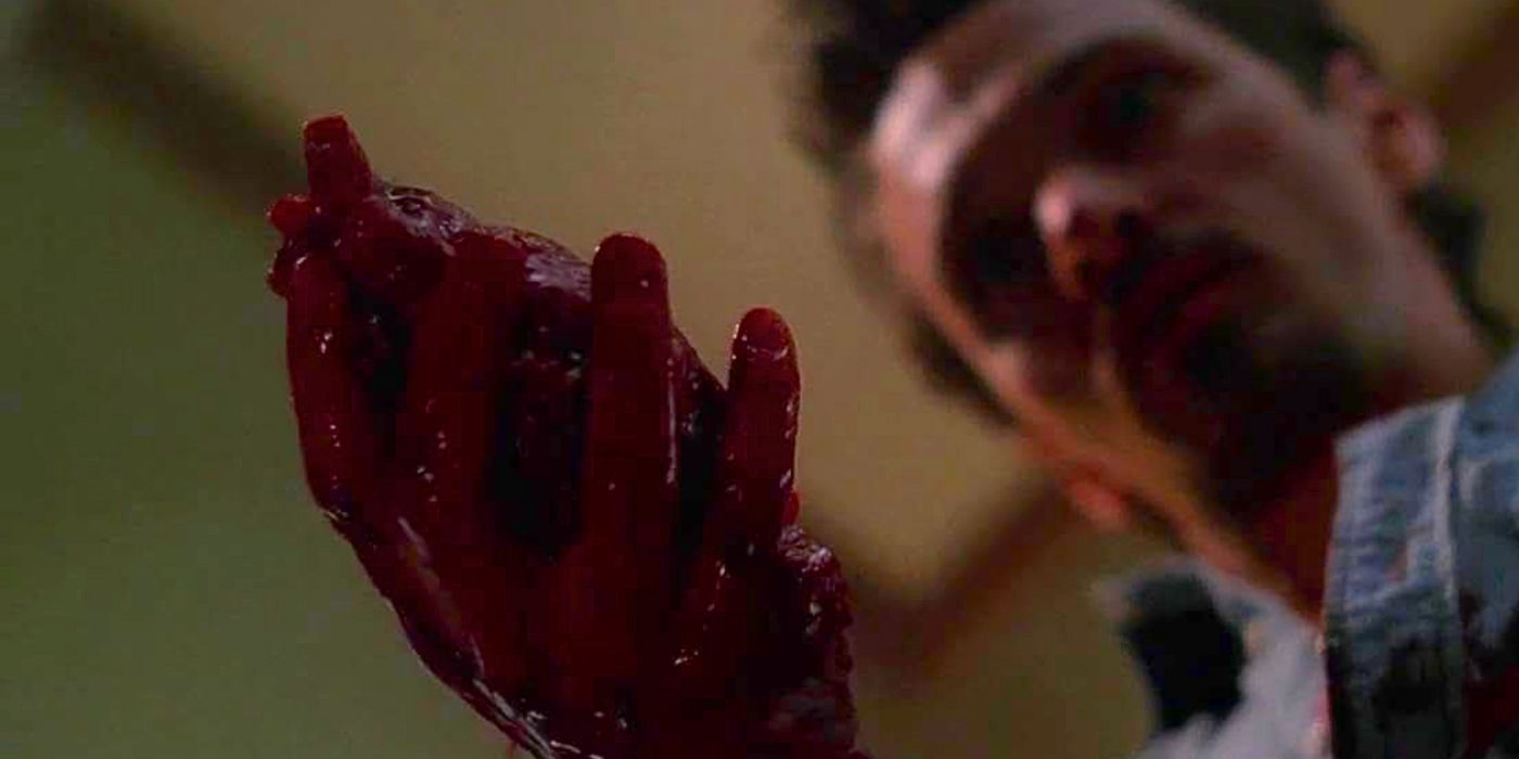 John Hawkes holds a bleeding human heart in his hand in episode Milagro from The X-Files