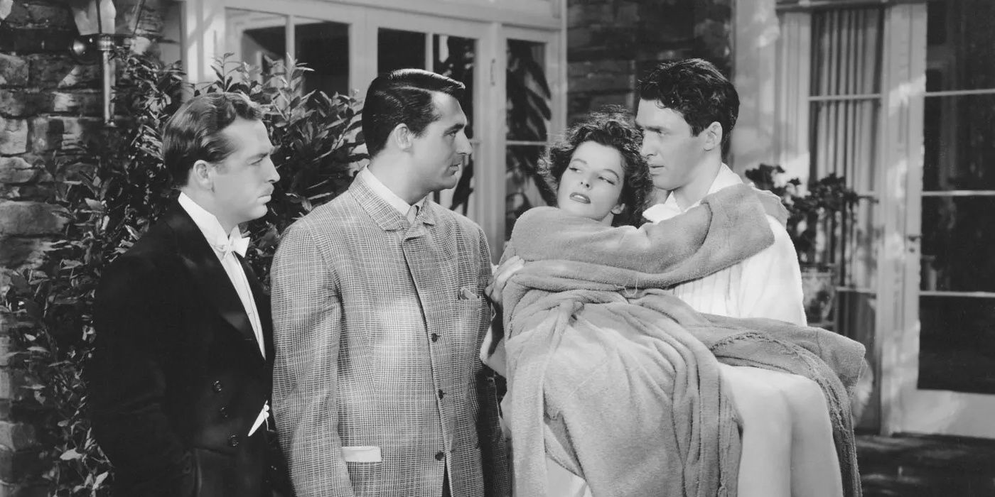 Mike carrying Tracy while Dexter and George watch in 'The Philadelphia Story'