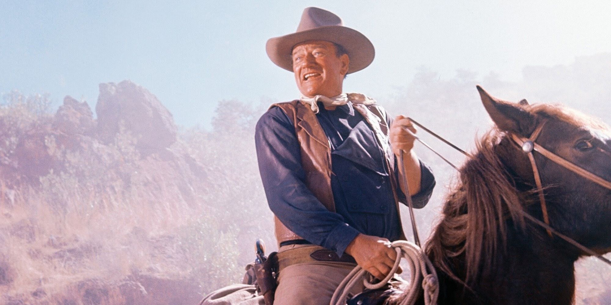 John Wayne riding horseback in The Sons of Katie Elder (1965)