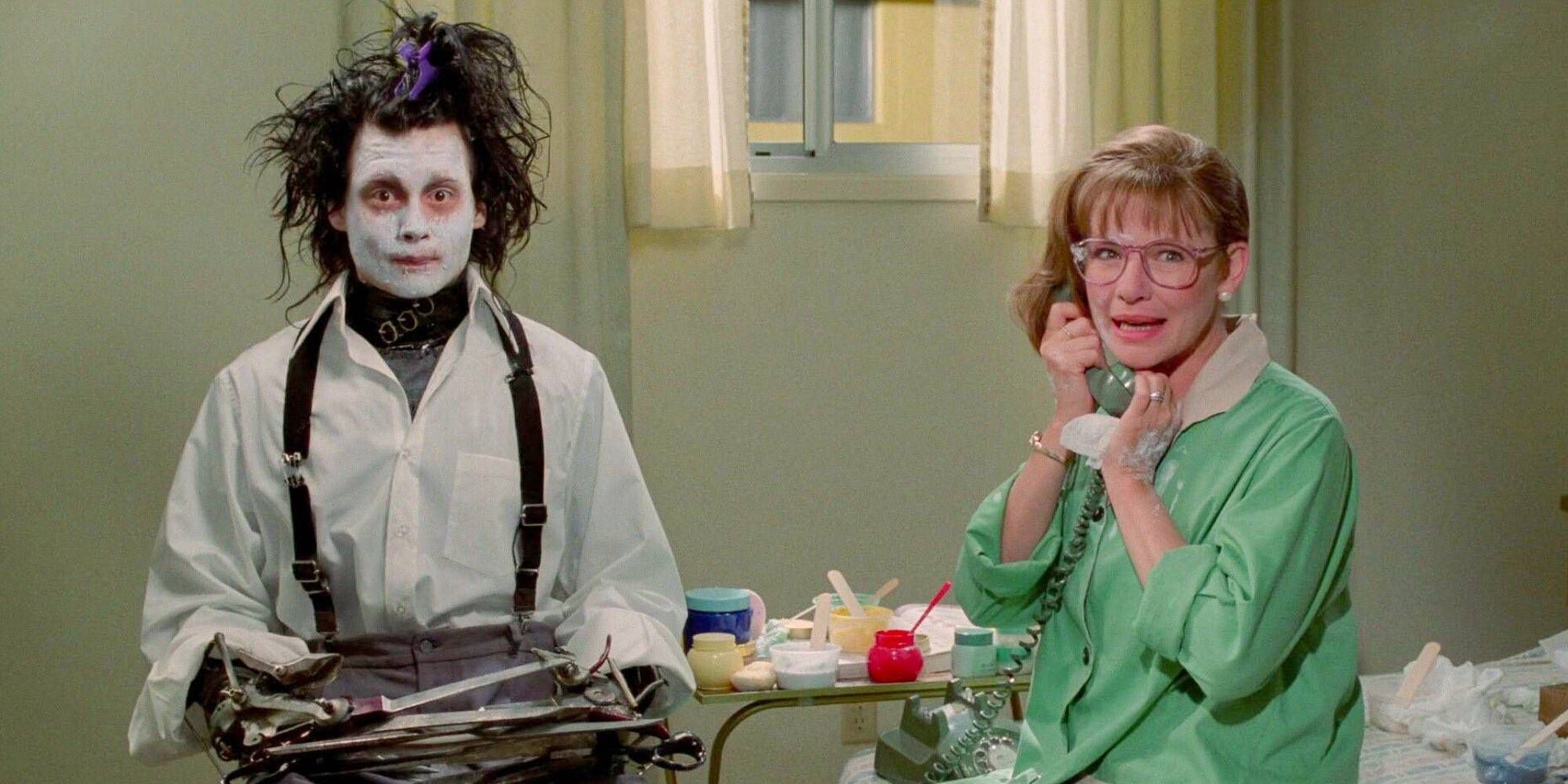 Johnny Depp as Edward Scissorhands sitting by Dianne Wiest as Peg's side as she answers a phone call in Edward Scissorhands.