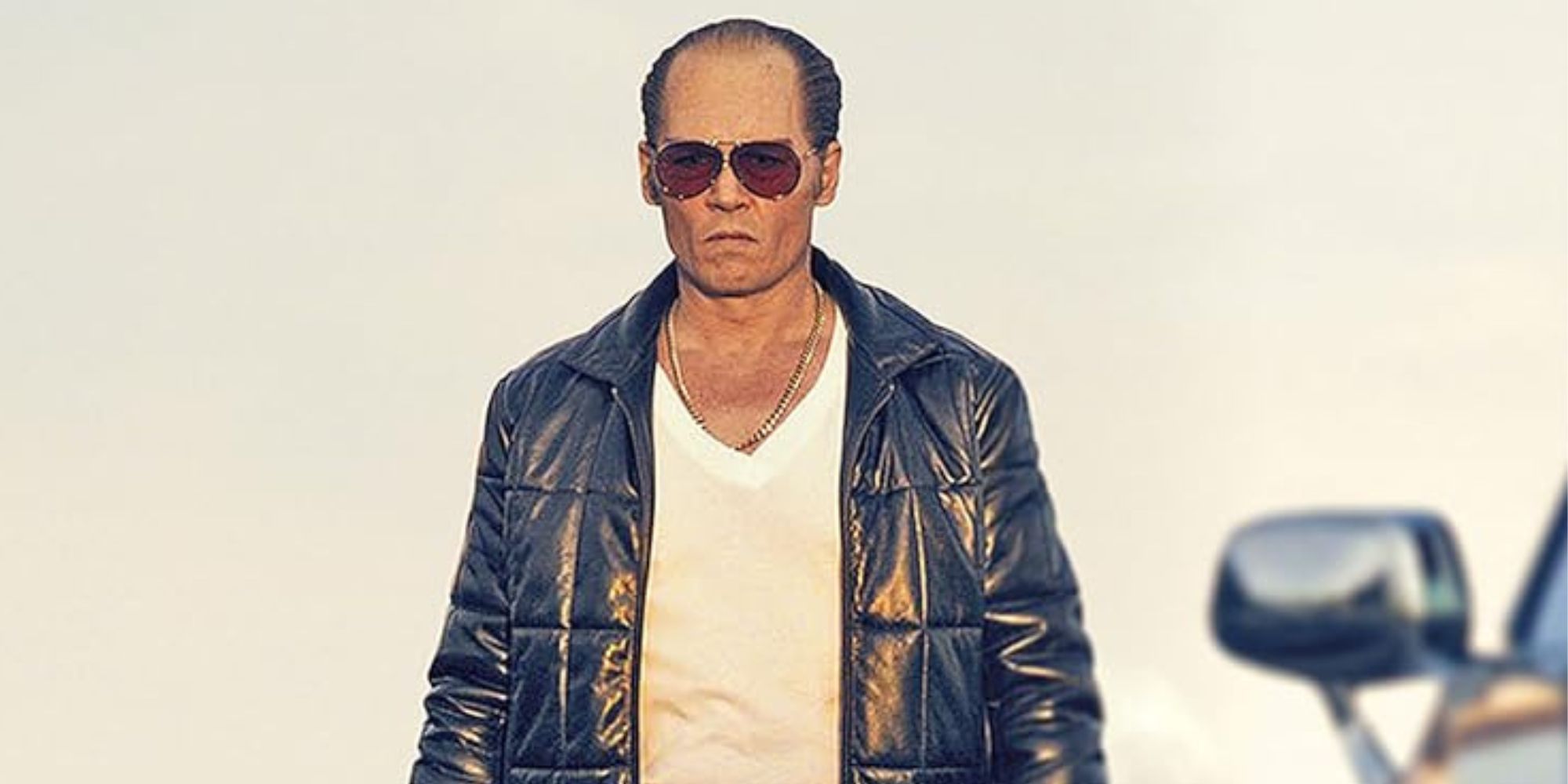 Whitey Bulge walking and looking determined in Black Mass (2015)