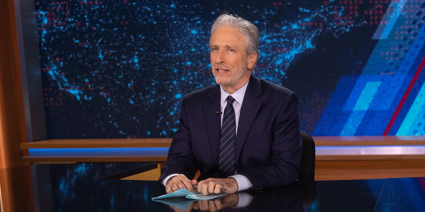 Jon Stewart delivering the news on The Daily Show