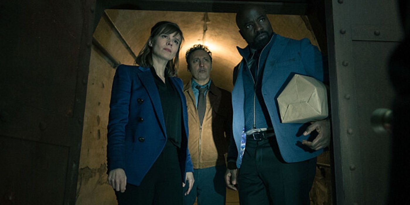 Katja Herbers, Aasif Mandvi and Mike Colter, in a tunnel looking at something suspiciously, as Dr. Kristen Bouchard, Father David Acosta, and Ben Shakir in Evil Season 4