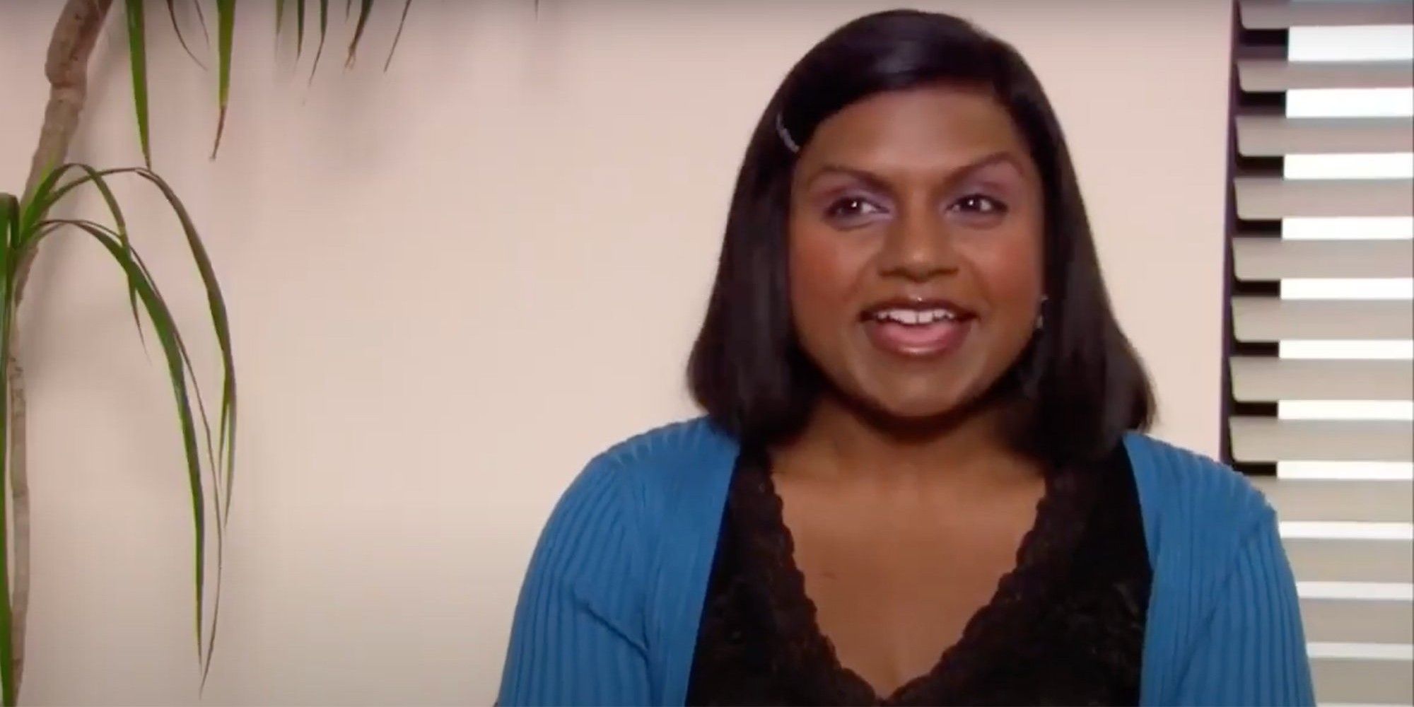 Mindy Kaling as Kelly Kapoor in a confessional on The Office.